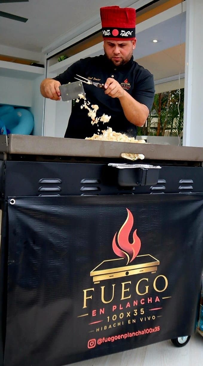 Chef Dexler preparing hibachi at a private event in Puerto Rico