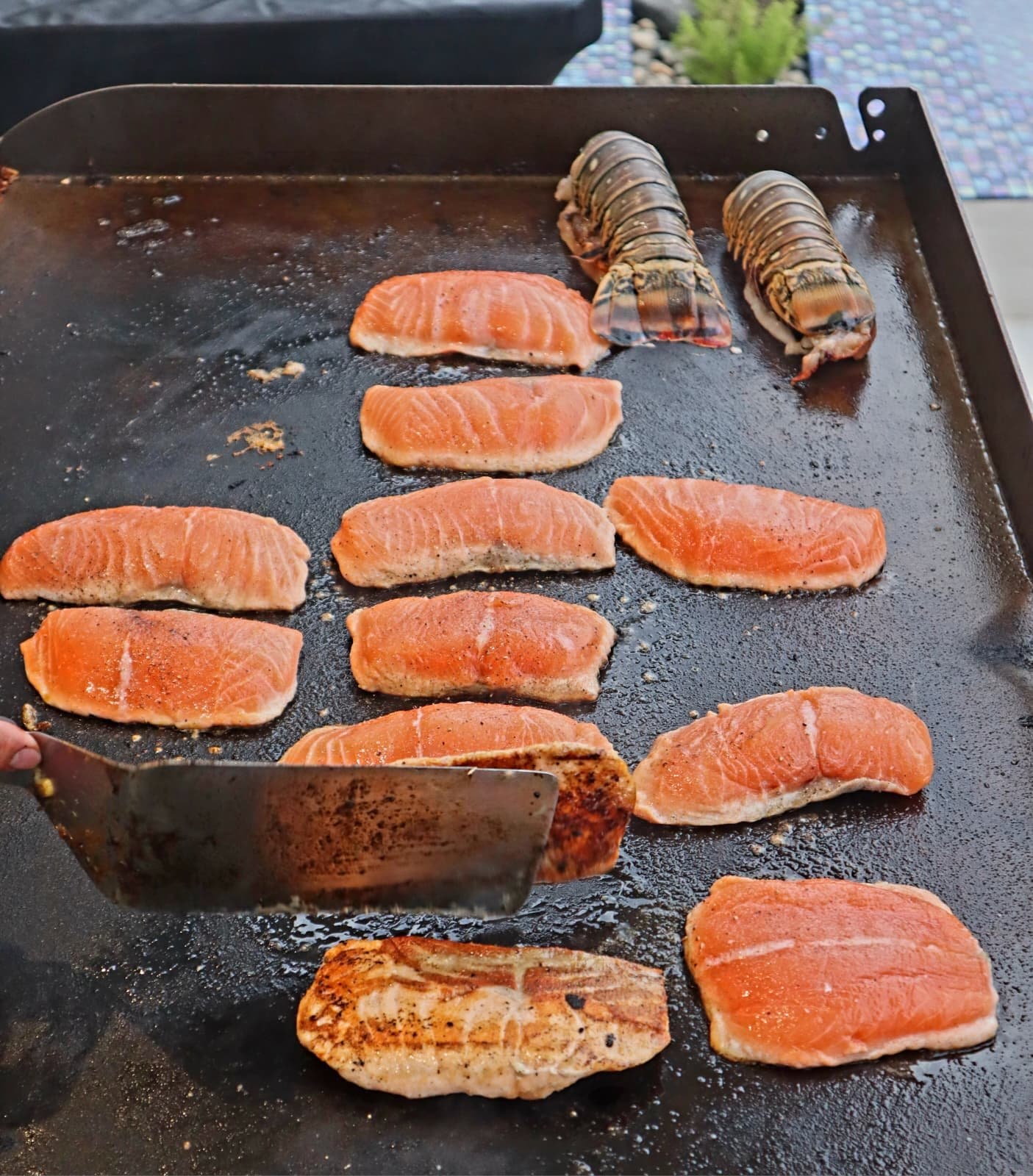 Hibachi salmon and lobster cooked on the teppanyaki grill